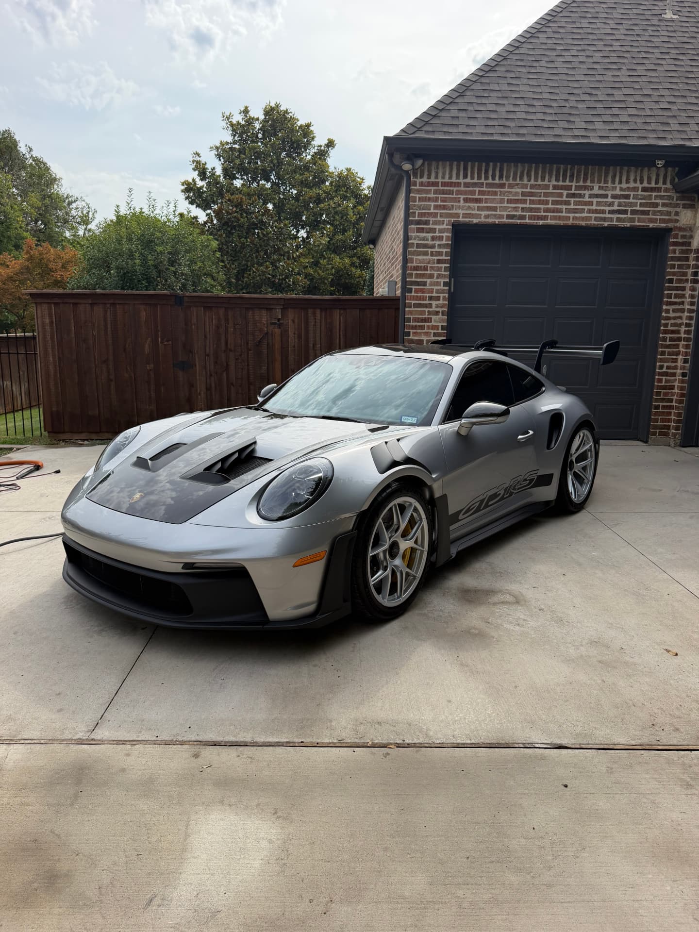 Silver Porsche 911 GT3 RS detailed in a North Texas driveway