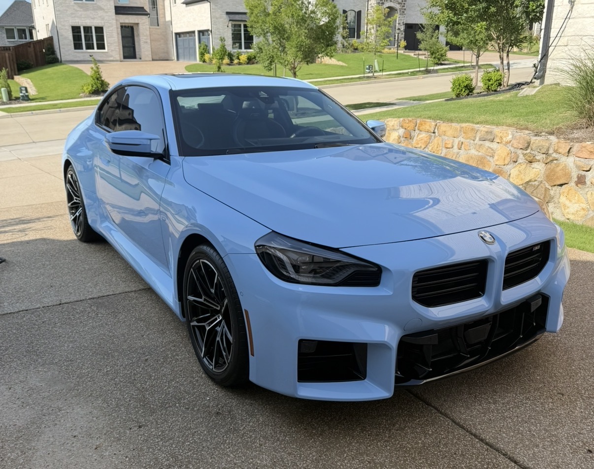 Light blue BMW M2 detailed in a North Texas driveway